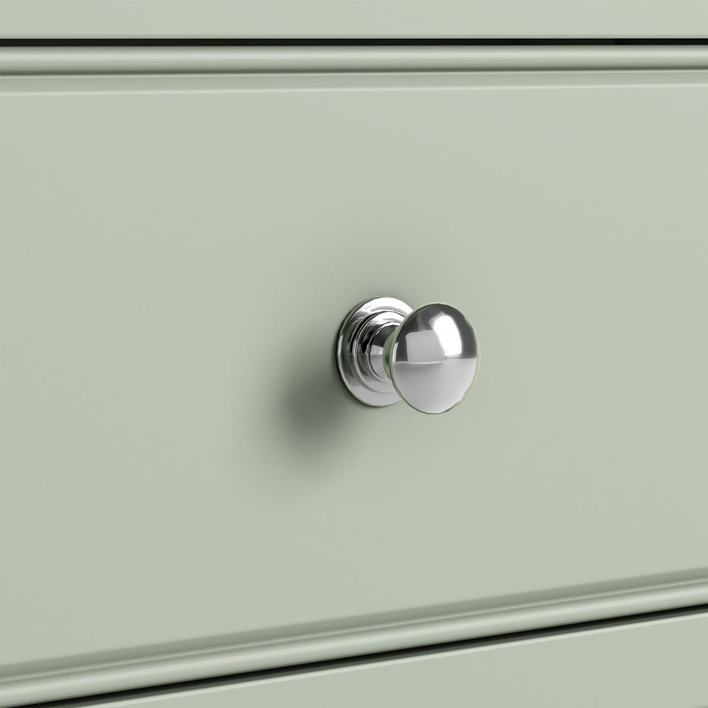 close up of sage green drawer with silver knob.