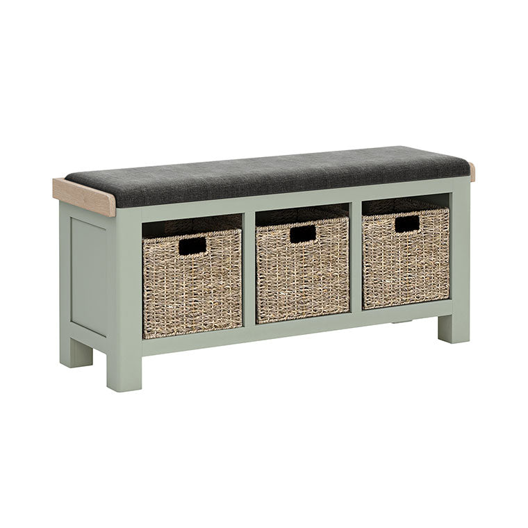 Sage painted oak hallway storage bench with storage baskets under the seat. Charcoal cushion on the bench.
