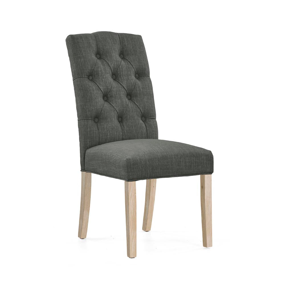 Grey upholstered chair with wooden legs on a white background