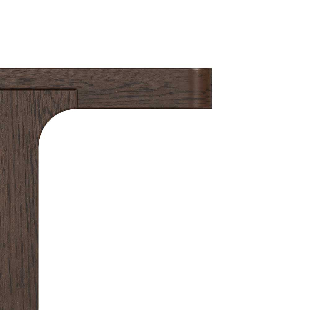 Close-up of a dark brown wood furniture corner, showing the top edge and left side with a curved inner corner detail on a plain white background.