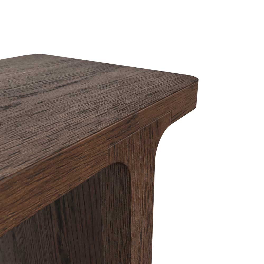 Close-up of a wooden console table corner on a white background