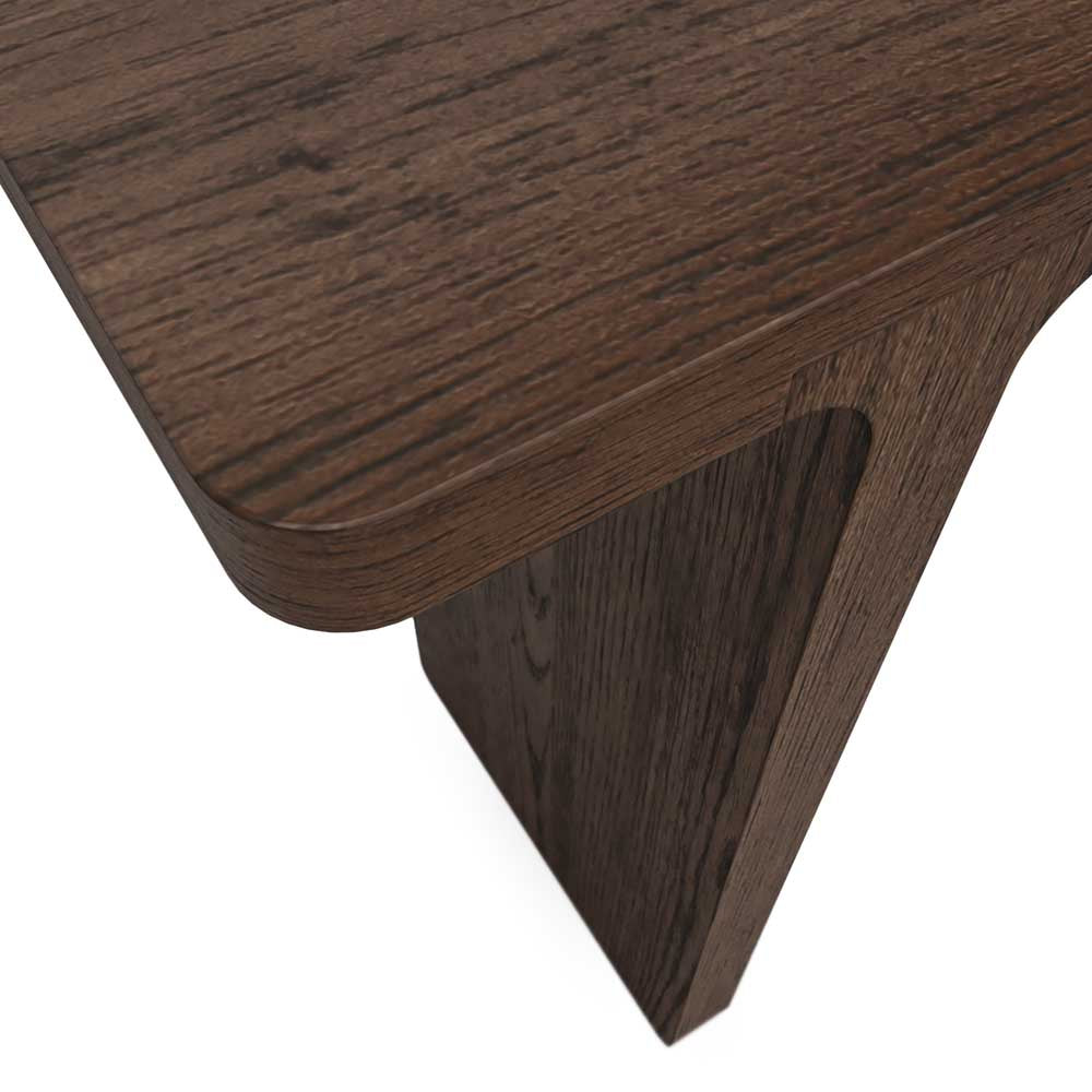 Close-up of a wooden console table corner with a white background
