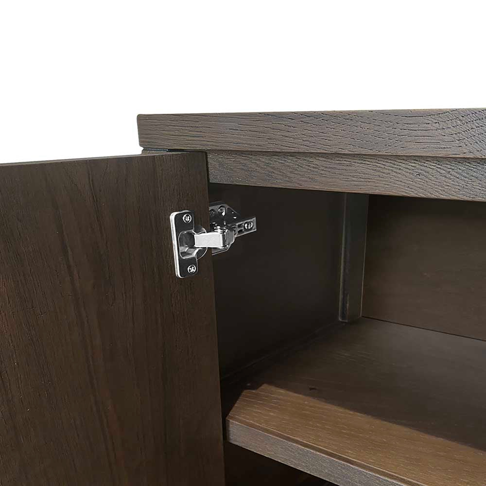 Close-up of a wooden cabinet with an open door and visible hinge.