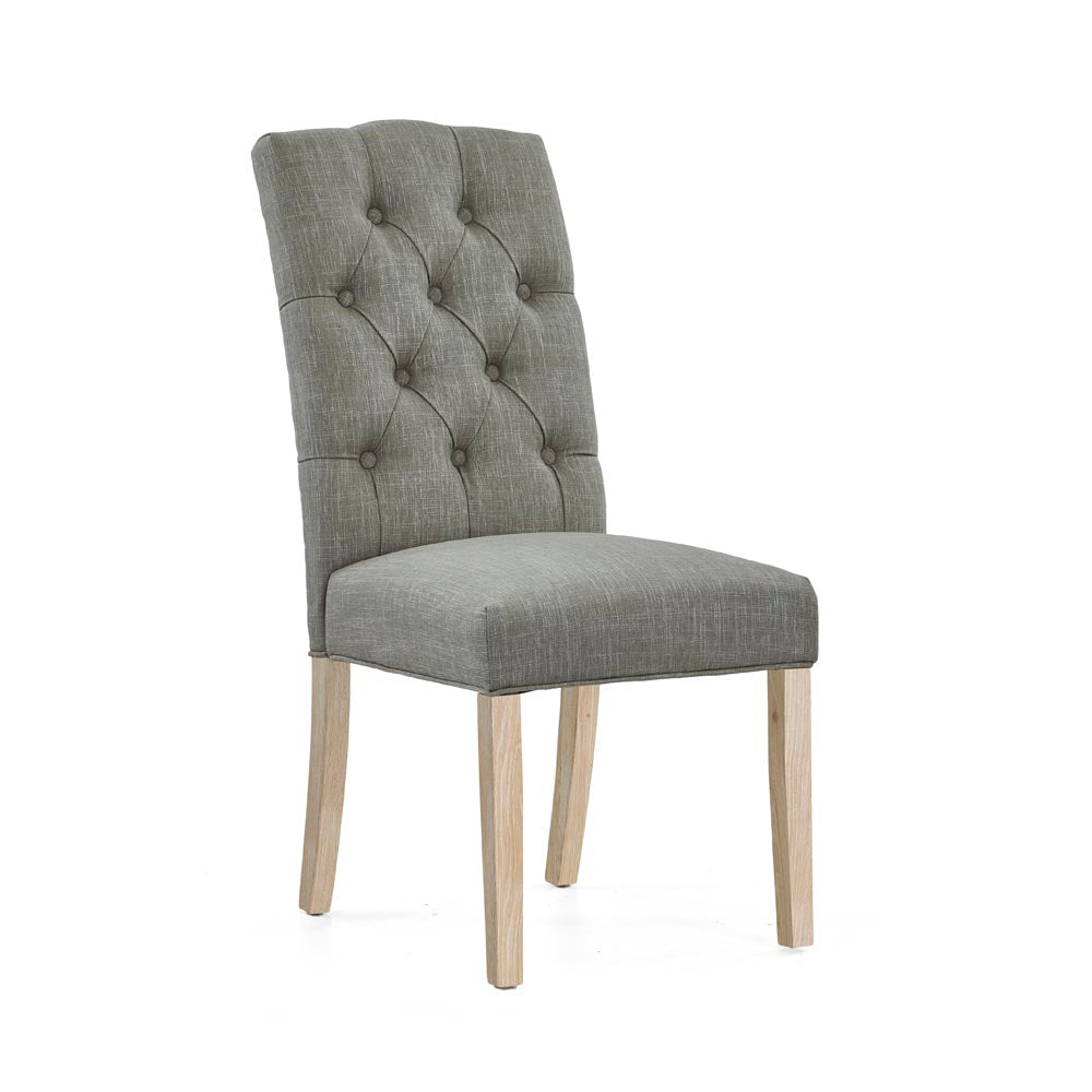 Grey upholstered chair with wooden legs on a white background