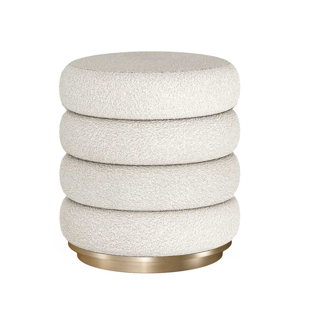 A modern cylindrical footstool resting on a brushed gold metal base, shown against a plain white background.