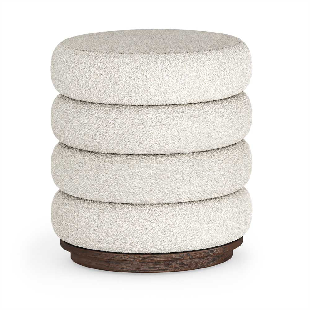 Cylindrical bouclé upholstered footstool with textured fabric and wooden base on a white background
