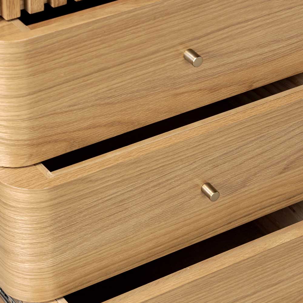 Close-up of wooden drawers with metallic knobs