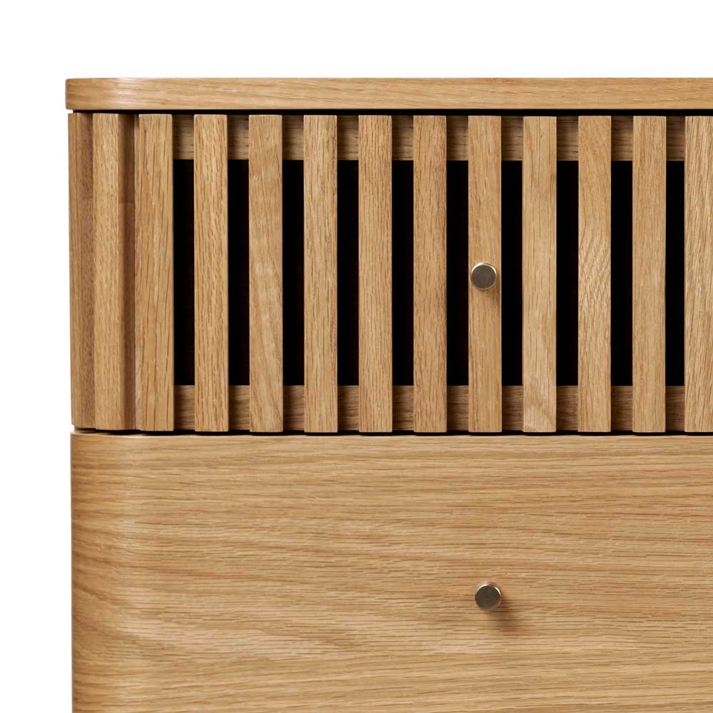 Wooden chest of drawers with a slatted design on a white background