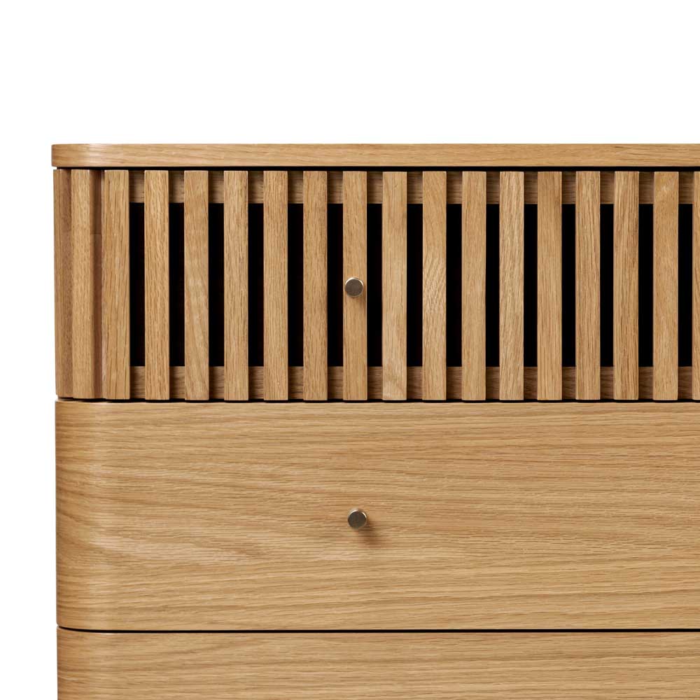 Wooden chest of drawers with a slatted design on a white background