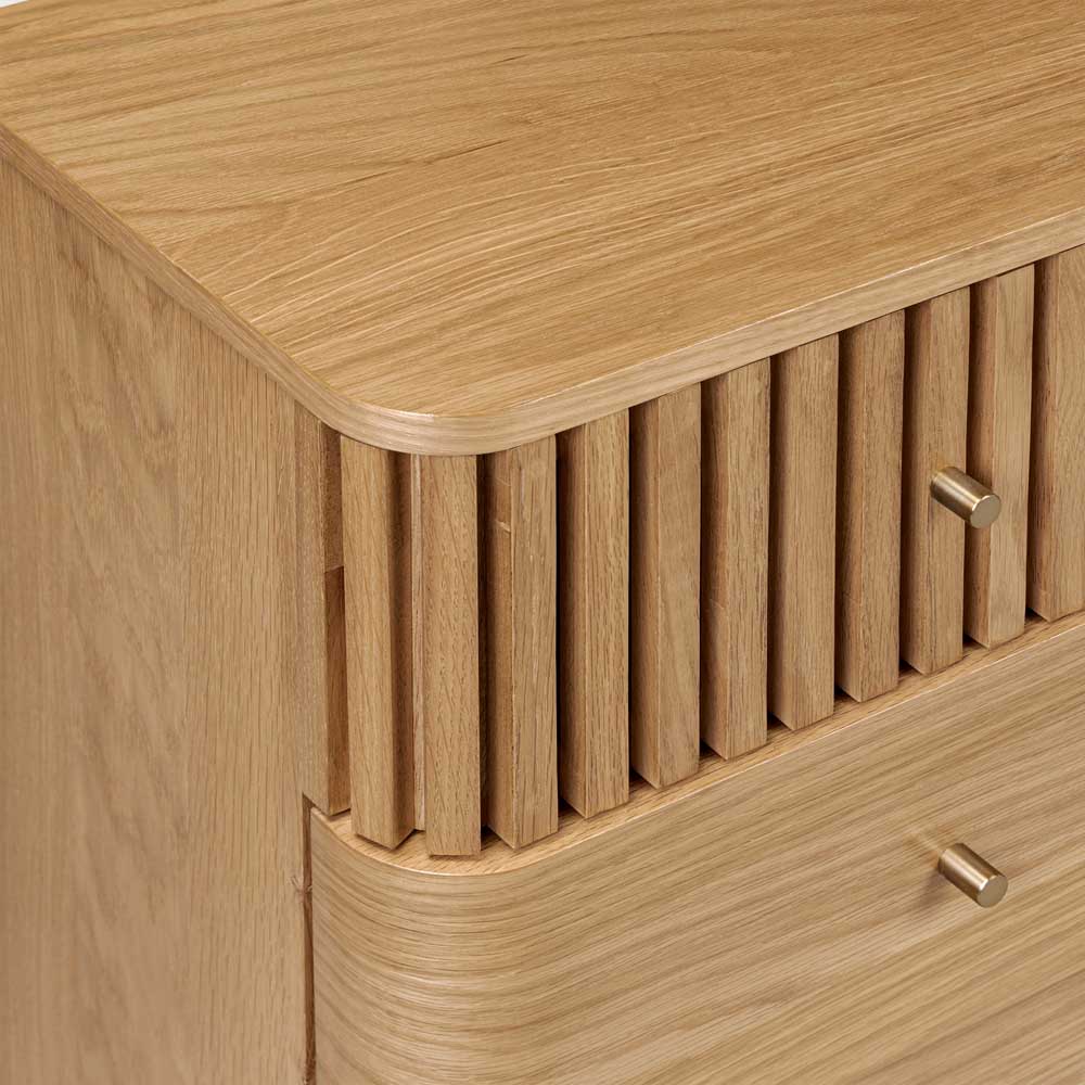 Wooden drawers with a slatted design and metallic gold coloured handles