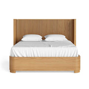 Wooden bed with white bedding on a white background