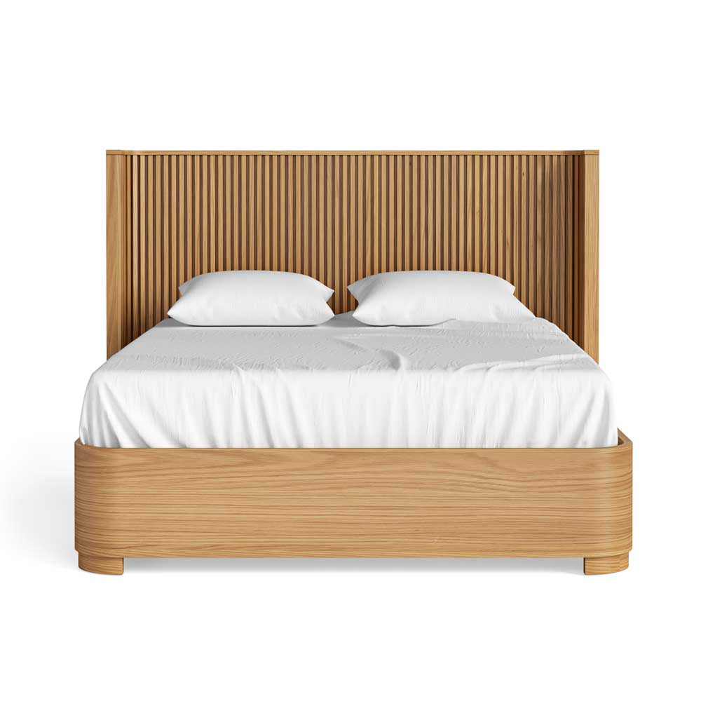 Wooden bed with white bedding on a white background