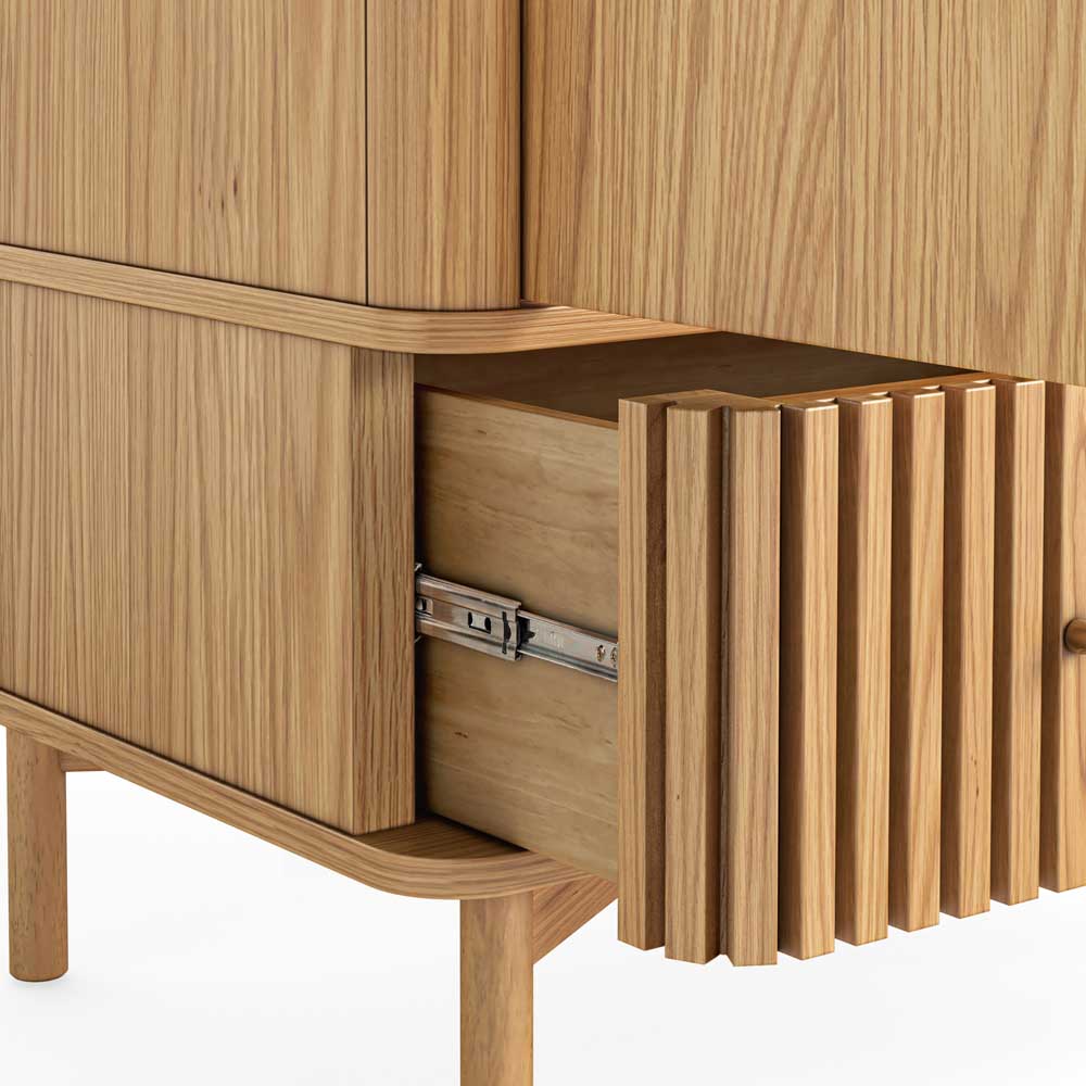 Wooden cabinet with a drawer open, showing a metallic handle.