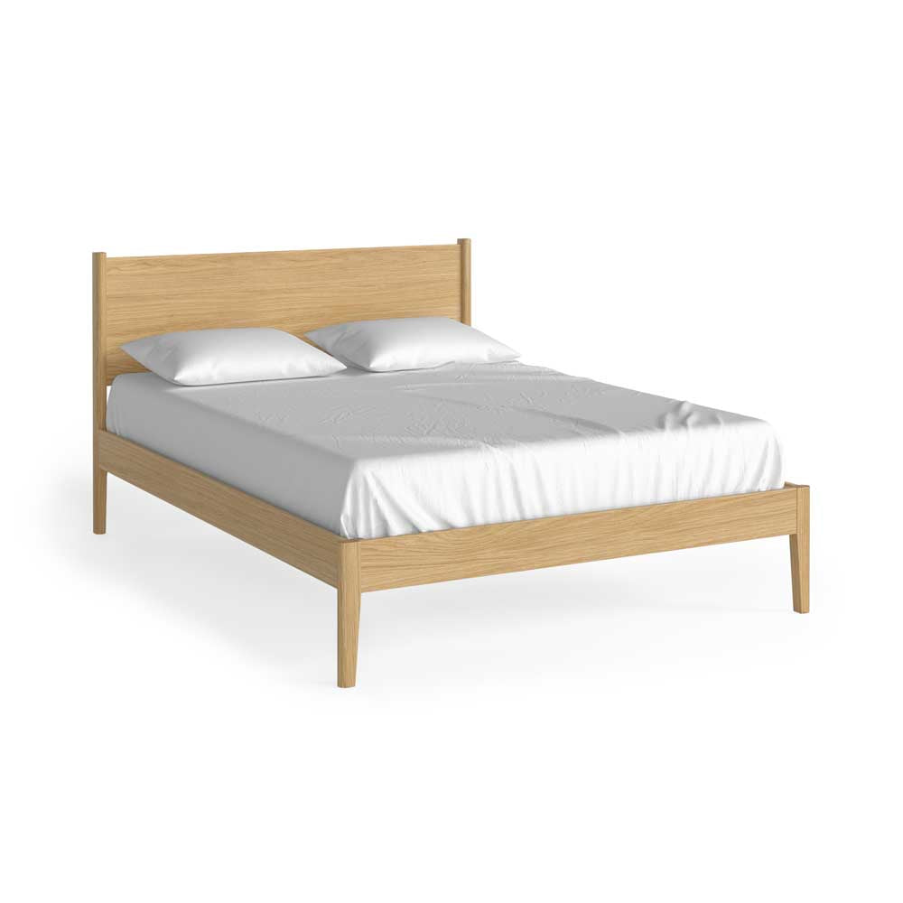 Natural Oak bed frame with white mattress and pillows on a white background