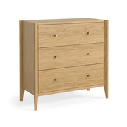 A three-drawer wooden chest of drawers with a light oak finish and small round brass knobs, shown on a plain white background.