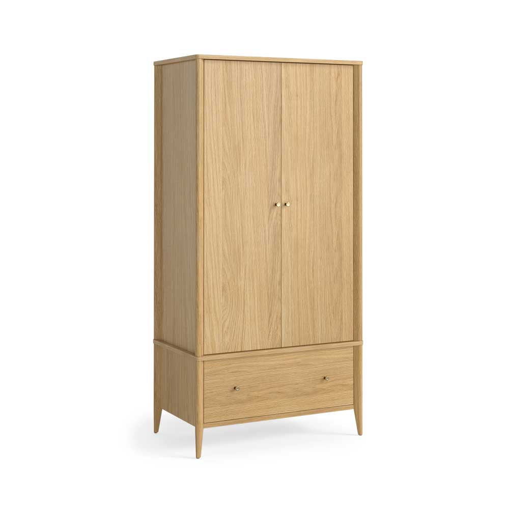 A tall two-door wooden wardrobe with a lower drawer, shown on a clean white background. The cabinet is made of light oak wood with a natural grain and features small round metal knobs.