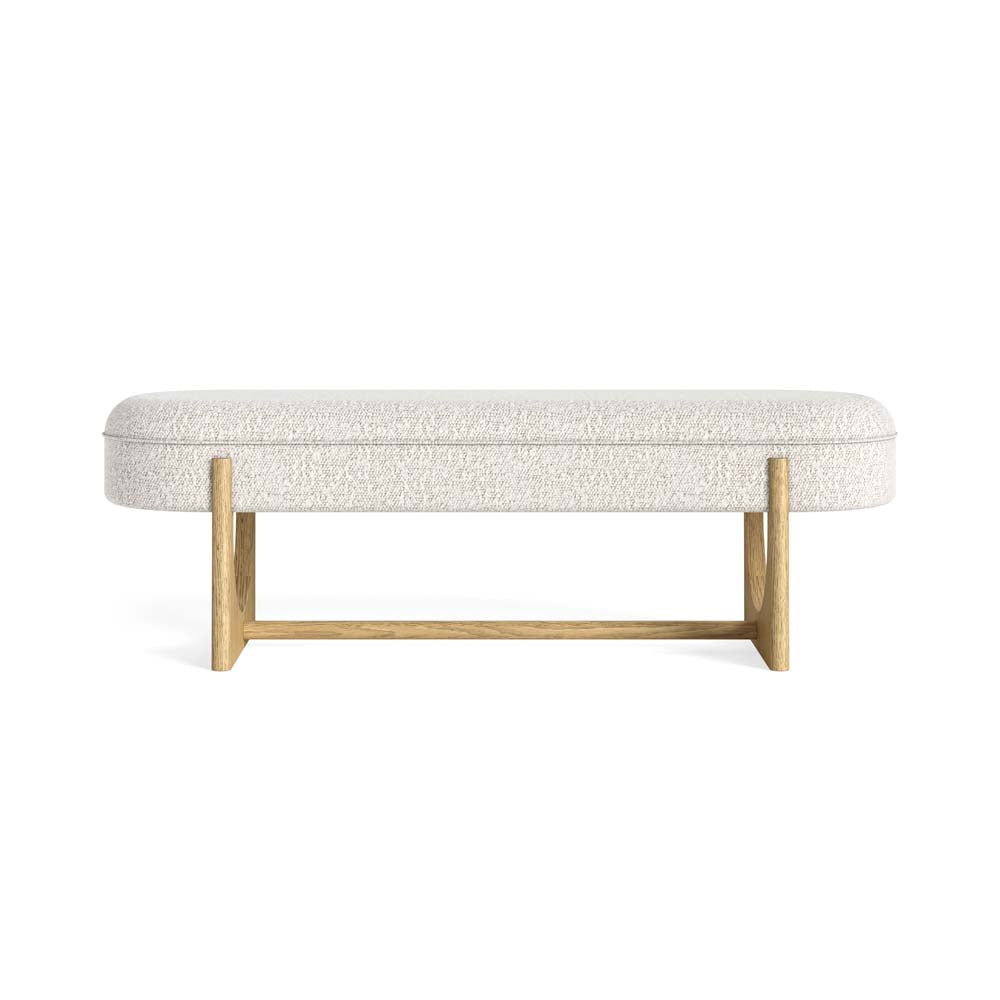 White upholstered bouclé fabric dining bench with light oak wooden frame on a white background