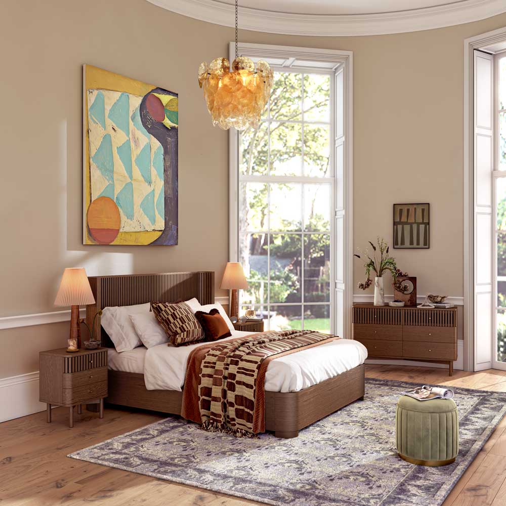 Modern bedroom with wooden bed, patterned rug, and decorative elements.