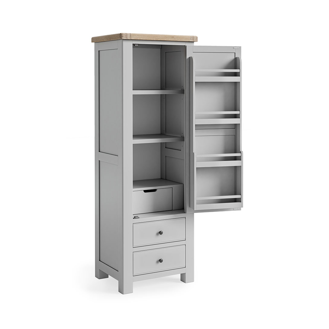 single larder with the door open showing off the internal storage. The interior of the door features 4 spcie rack type shelves. The main unit comprises of 3 shelves, a small inset drawer underneath these. Then when the dor is closed, 2 further full lenght/width drawers are visible underneath.