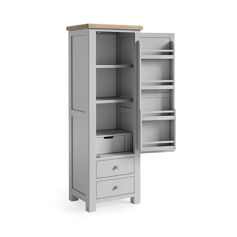single larder with the door open showing off the internal storage. The interior of the door features 4 spcie rack type shelves. The main unit comprises of 3 shelves, a small inset drawer underneath these. Then when the dor is closed, 2 further full lenght/width drawers are visible underneath.
