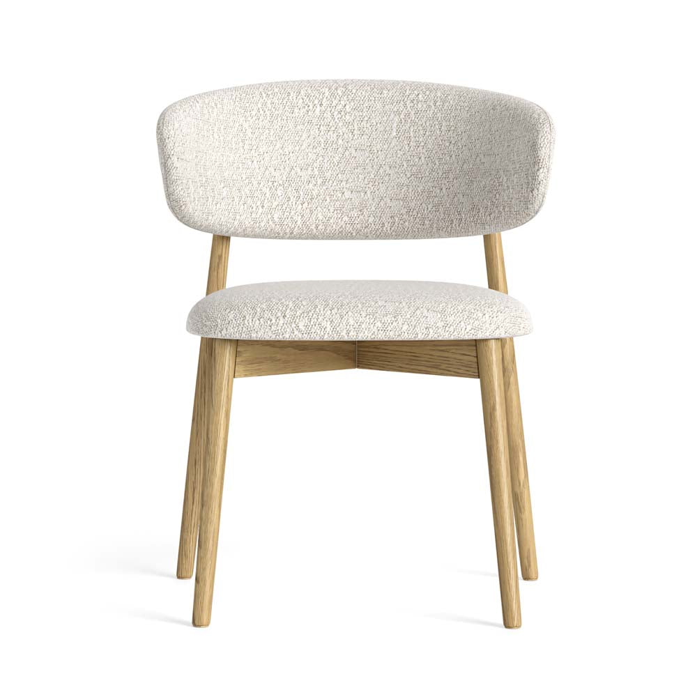 Chair with white bouclé fabric upholstered seat and backrest on a white background