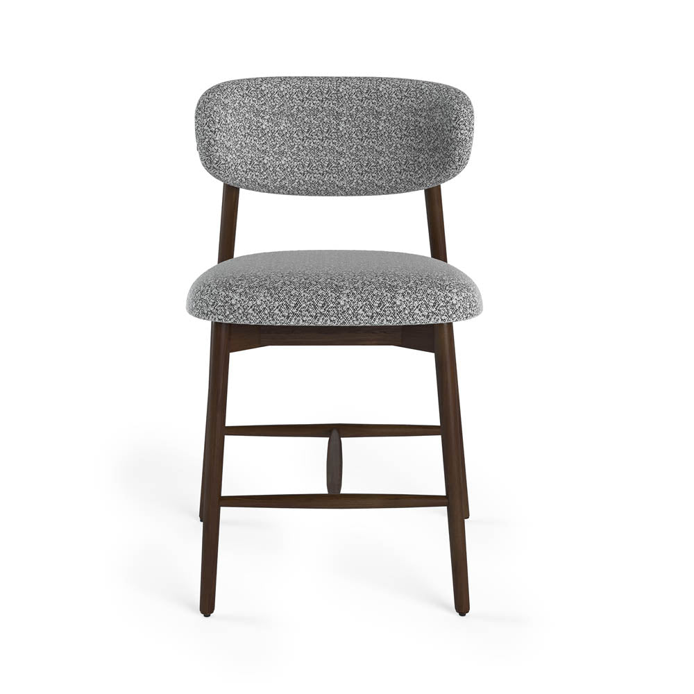 Gray cushioned chair with wooden legs on a white background
