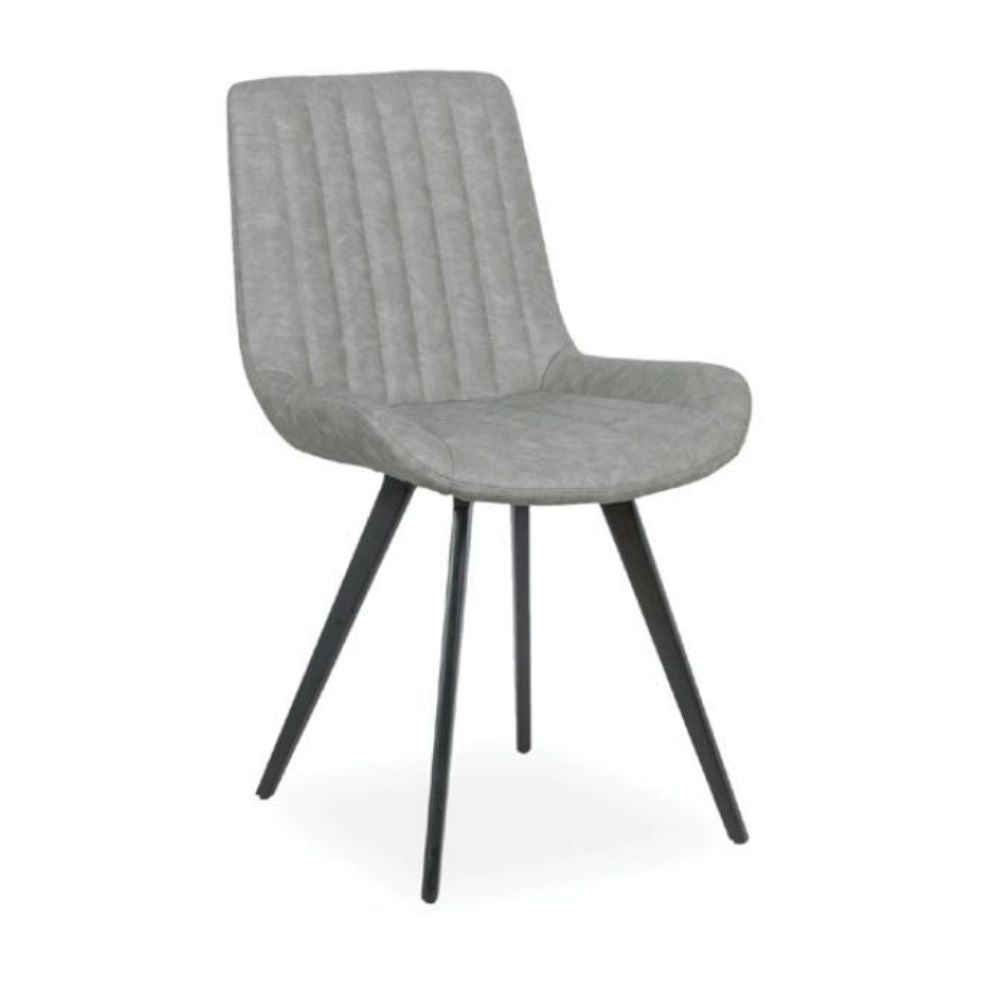 A modern dining chair with a light gray upholstered seat and a vertically channel-tufted backrest, supported by four black tapered metal legs, shown against a plain white background.