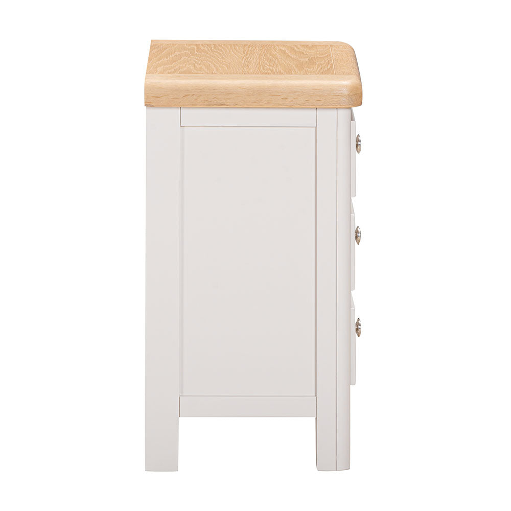 White cabinet with a wooden top on a white background