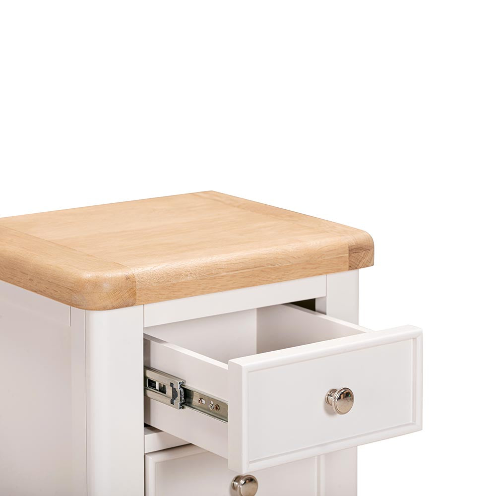 Light grey-beige bedside locker with oak top and open drawer on a white background