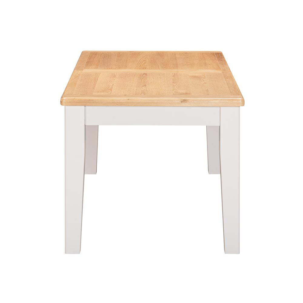Wooden table with ight grey-beige  base on a white background