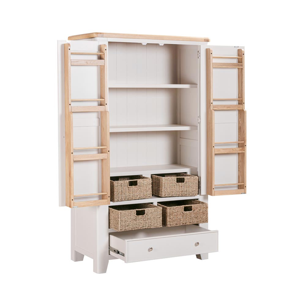 Light grey-beige kitchen larder with wooden doors and wicker baskets on a white background