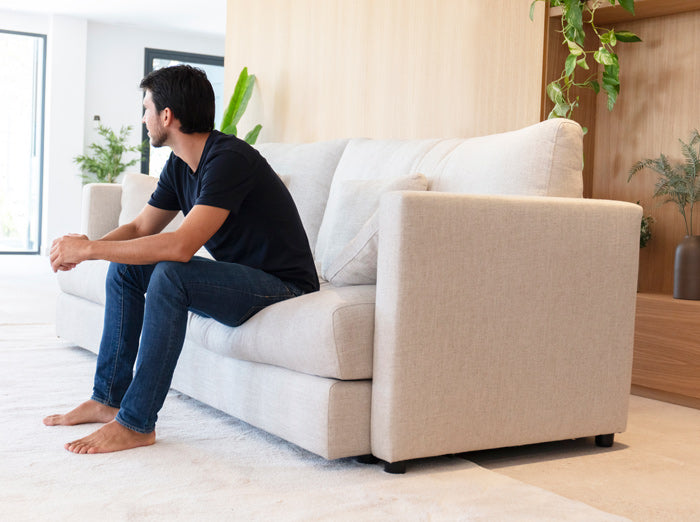 Hector Model by Fama from side angle with male model sitting down