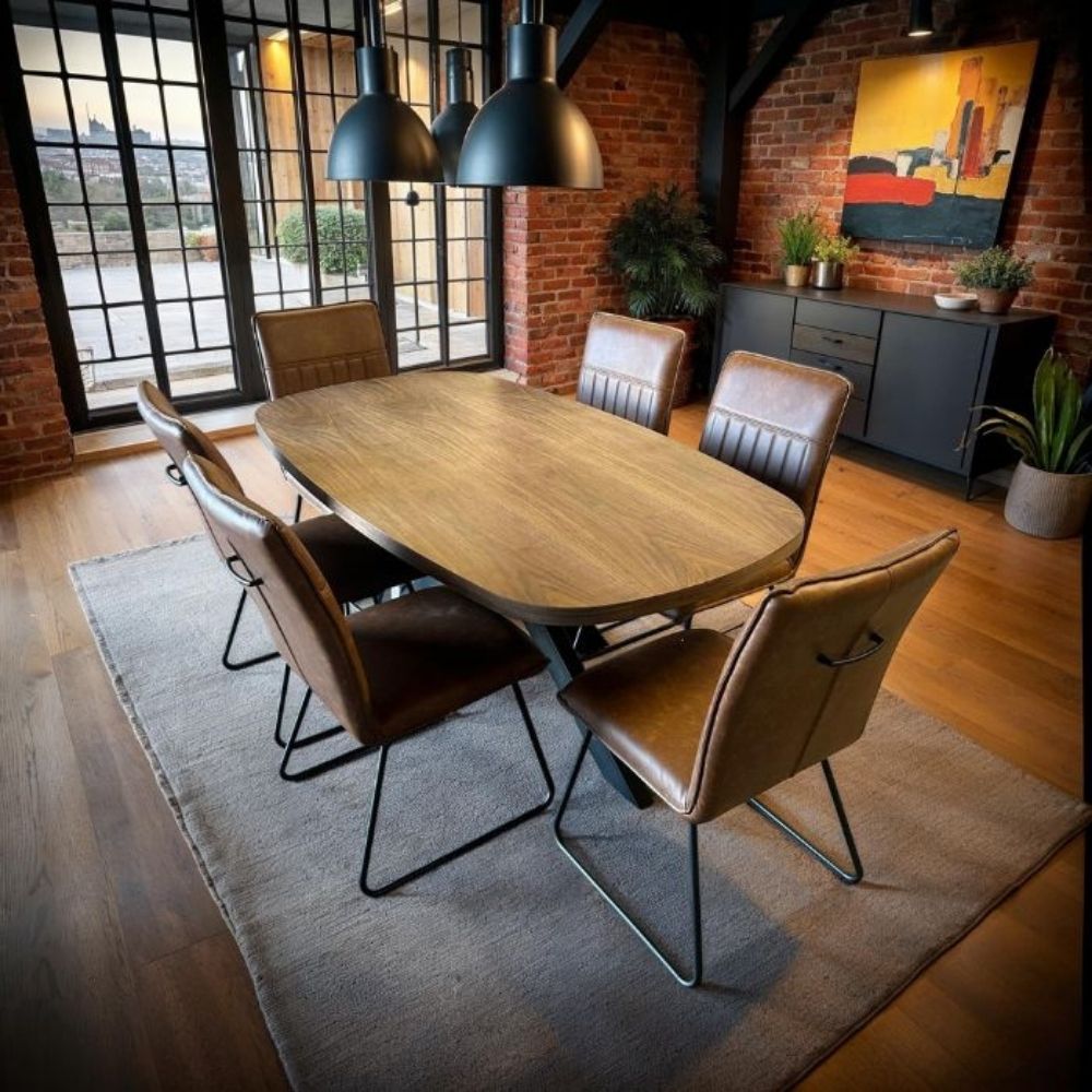 Dining room with wooden table and chairs in a modern interior setting.