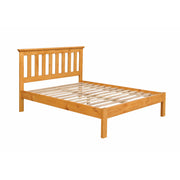 Pine slatted bedframe on a white background