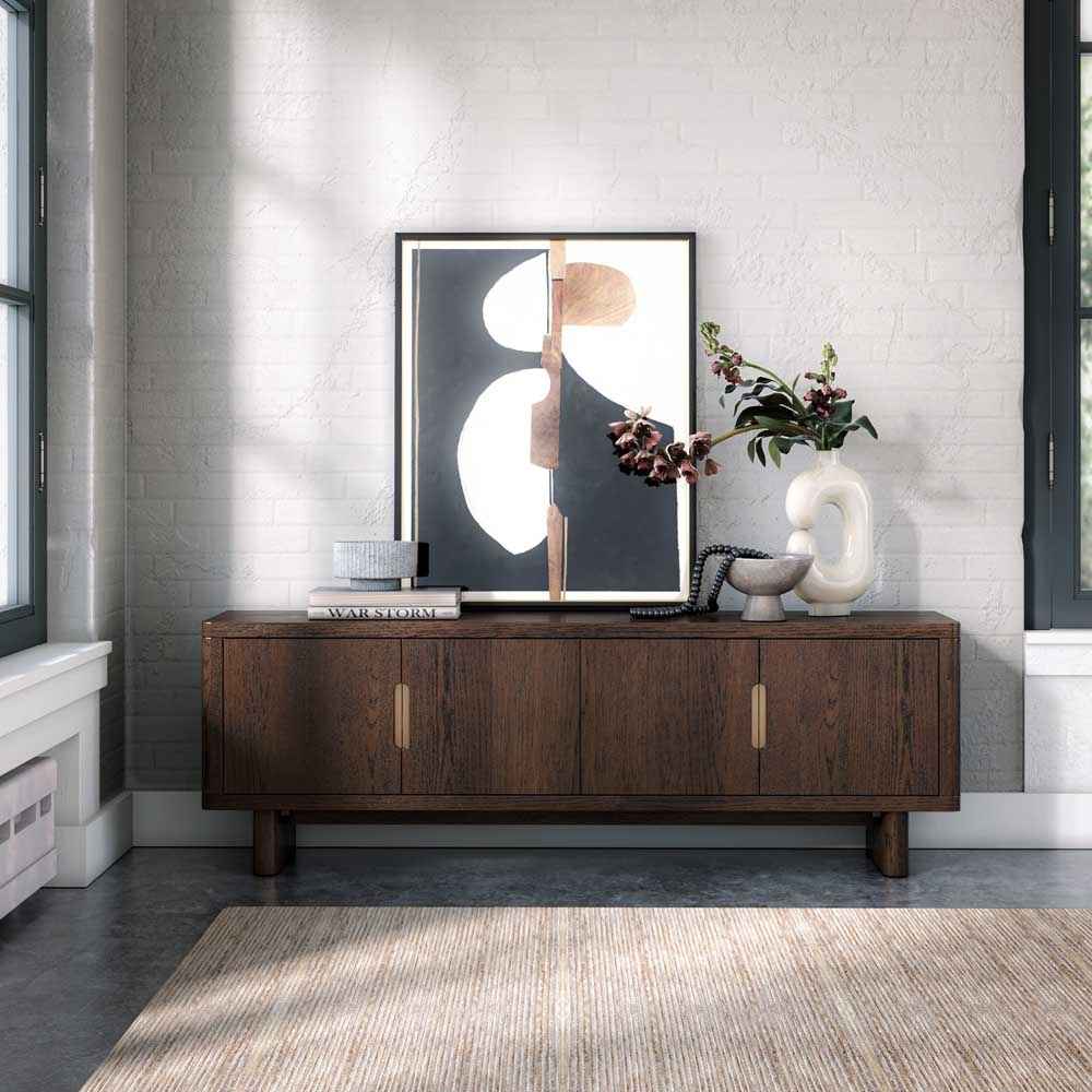 Wooden TV / media entertainment unit / sideboard with decorative items against a grey wall