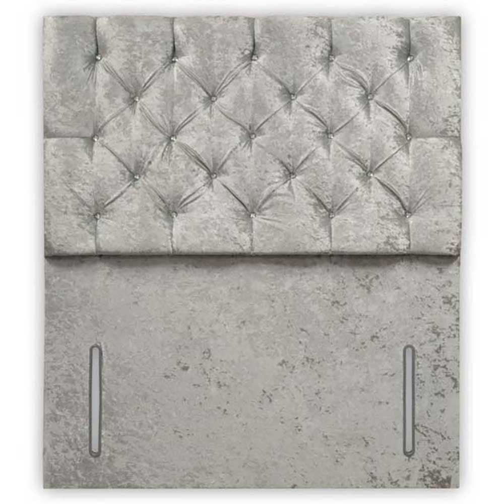 Gray tufted headboard with concrete-like base on a white background