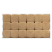 Beige cushioned headboard on a white background