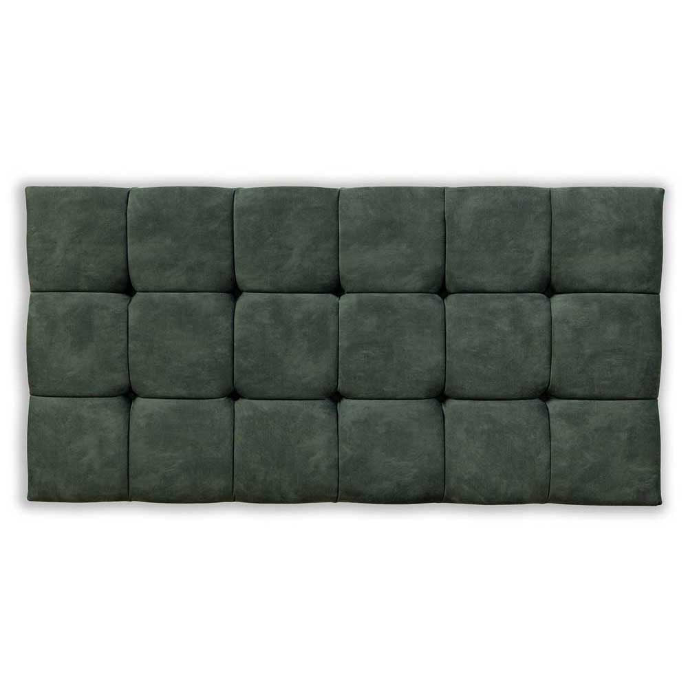 Green tufted headboard on a white background