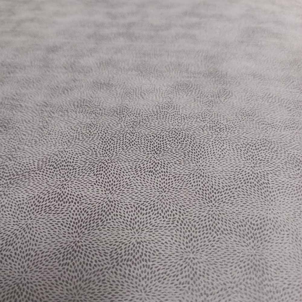 Close-up of a textured gray fabric with a subtle pattern