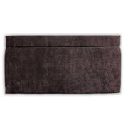 Charcoal velvet headboard on a white background