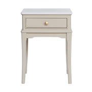Small side table with a drawer and marble top on a white background