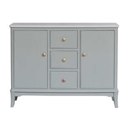 A sage green wooden sideboard or credenza with three drawers in the center and two doors on the sides, accented with small round gold knobs, shown against a plain white background.