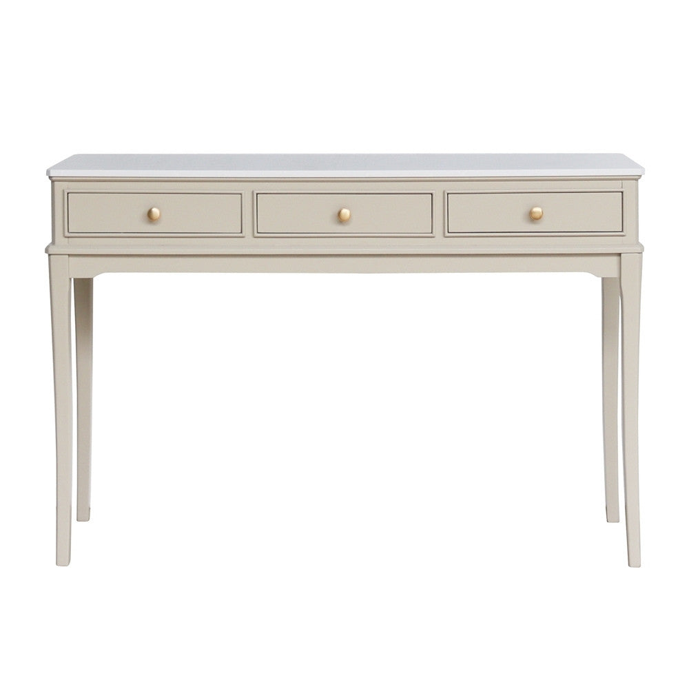 Light beige / stone coloured console table with three drawers on a white background