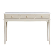 Light beige / stone coloured console table with three drawers on a white background
