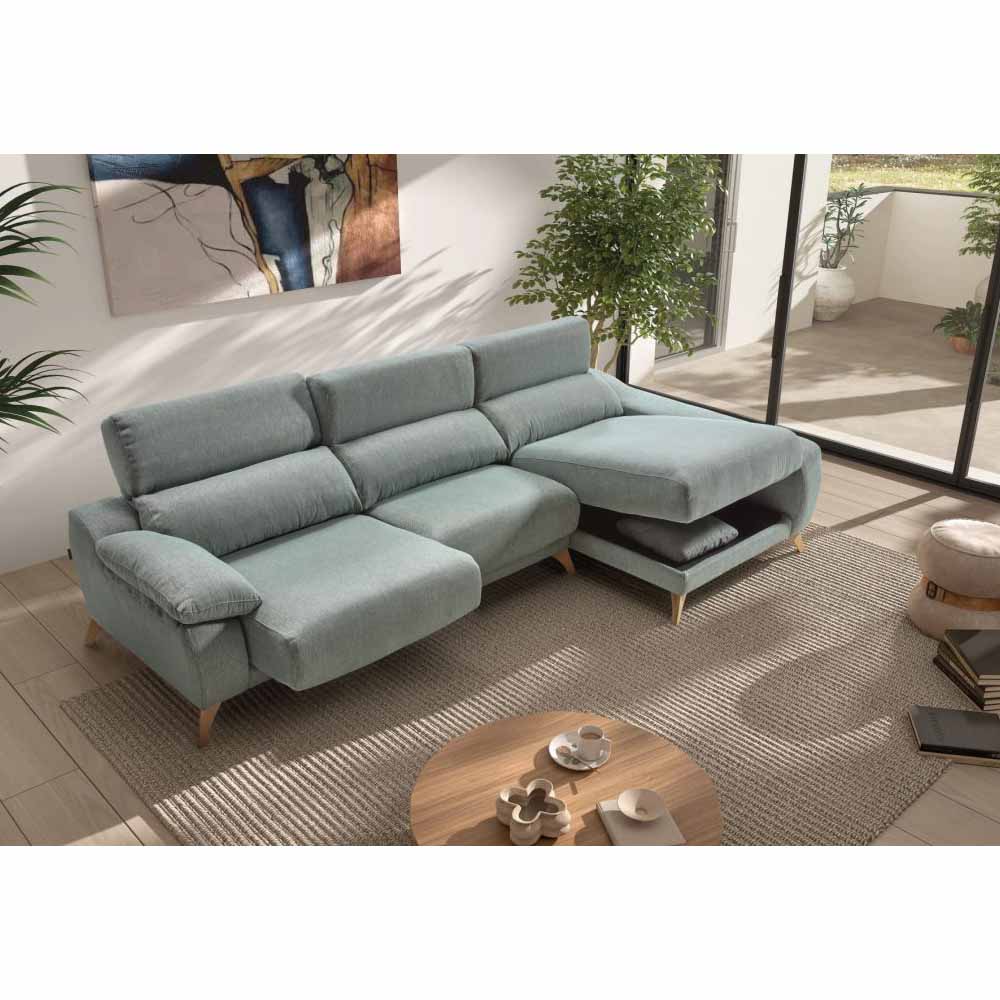 Light blue sectional sofa in a modern living room with a coffee table and decor items.
