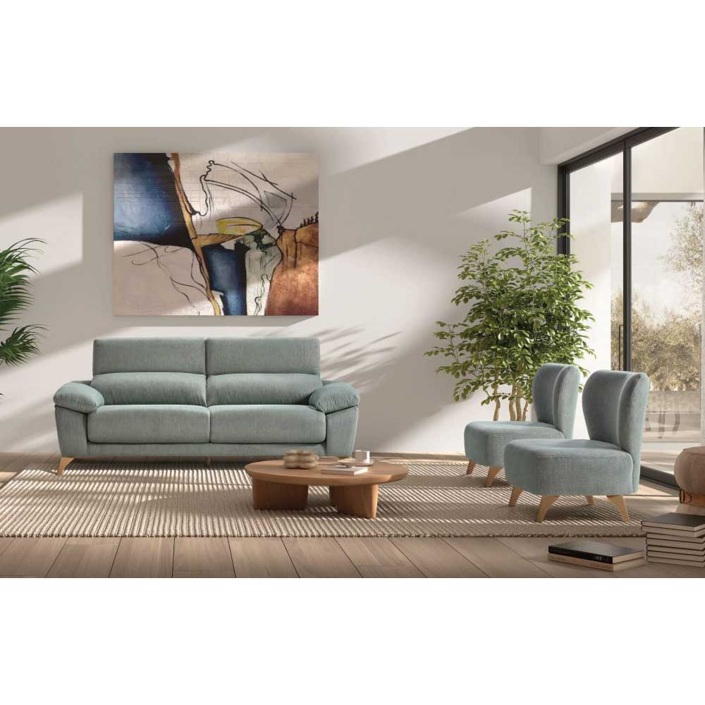 Modern living room with light blue sofa and chairs, wooden coffee table, and abstract art on the wall.