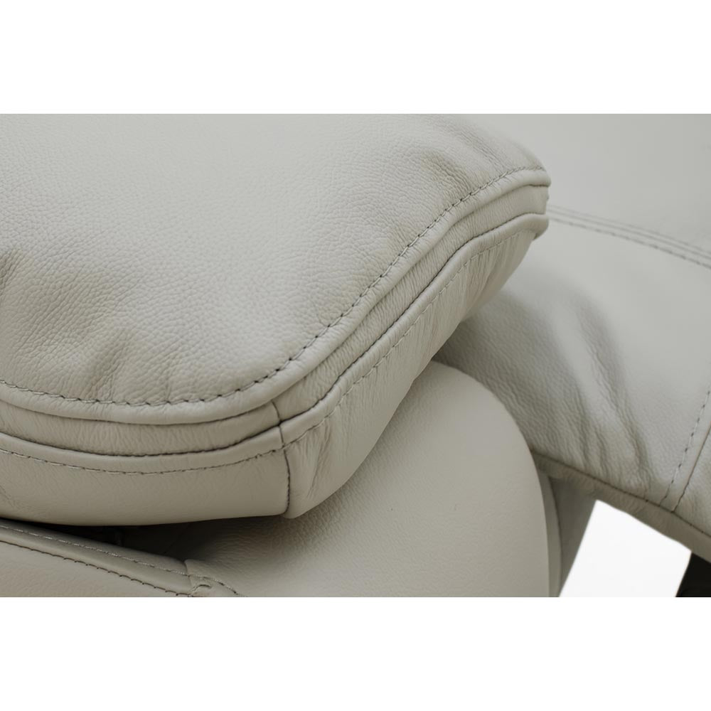 Close-up of light grey leather armrest and seat 