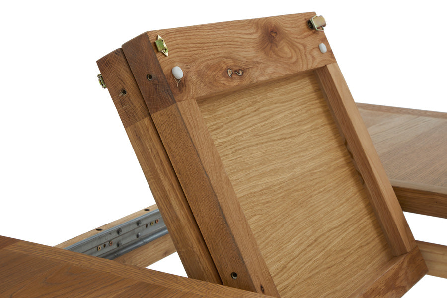 Burford Butterfly extending pieces folding up from underneath table