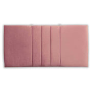 Pink velvet upholstered headboard with a soft texture on a white background