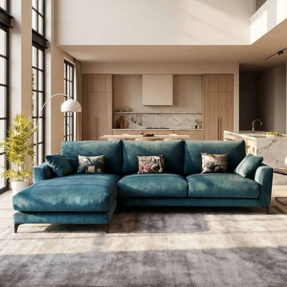 Blue Fama sectional sofa in a modern living room with kitchen in the background